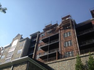 Scaffolding is setup on a ~4 story brick building.