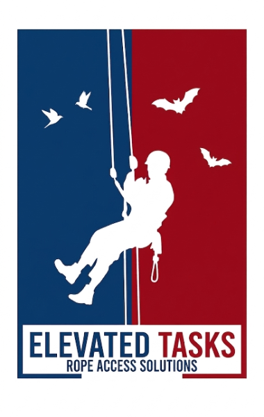 Rope access technician performing exterior building work